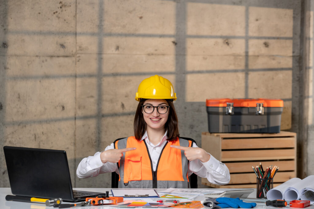 engineer cute young smart brunette girl civil worker helmet vest focused
